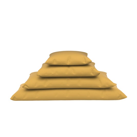 Dandelion yellow lumbar pillows stacked on a white background.