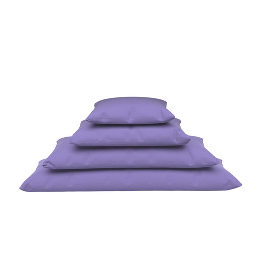 Four lavender purple lumbar pillows stacked on a white background.