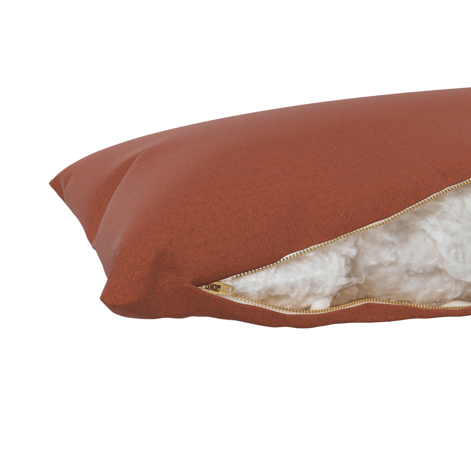 Product image of a body pillow with a burnt orange pillow cover. Zipper open showing cotton inside.