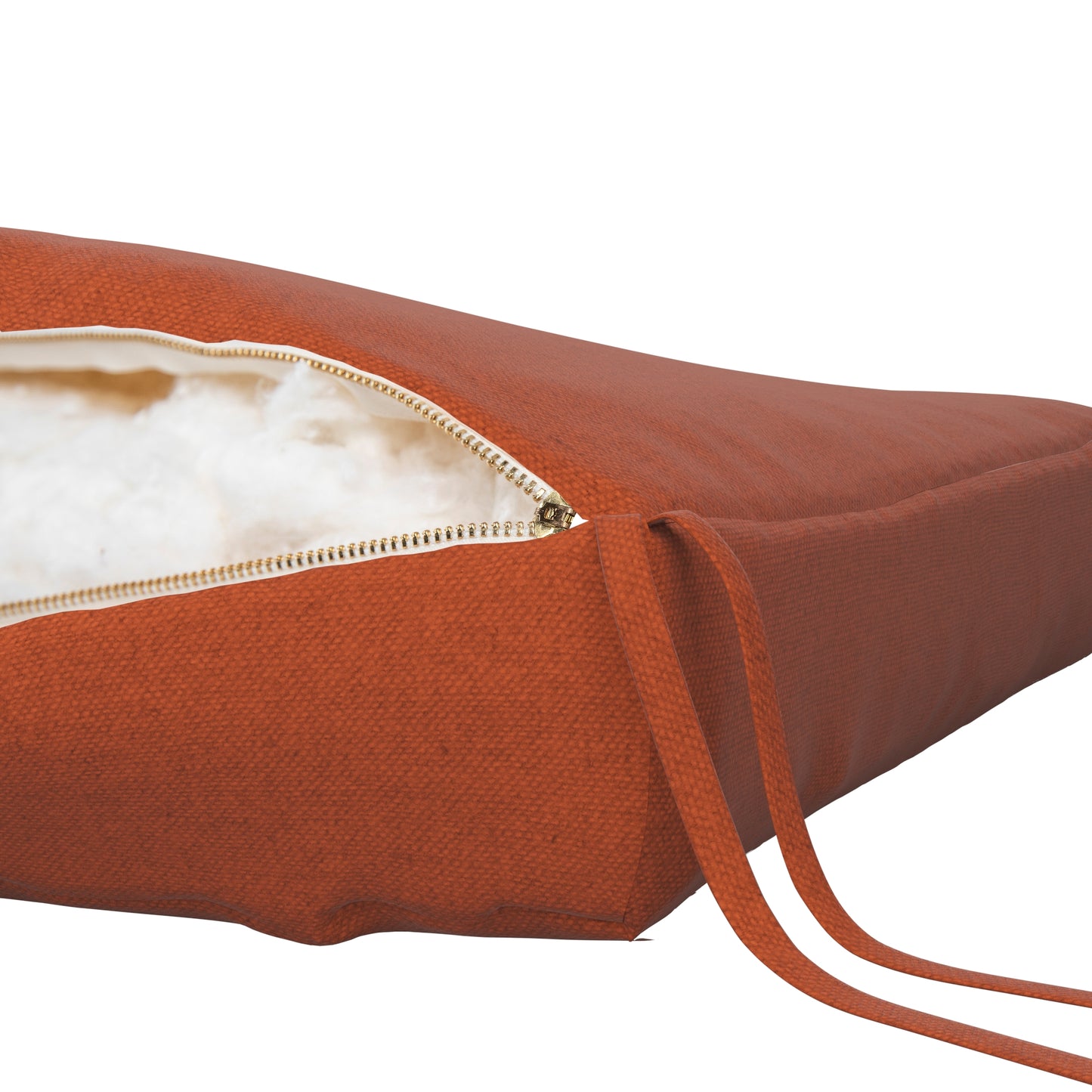 Burnt orange seat cushion on a white background. Zipper open showing cotton inside.