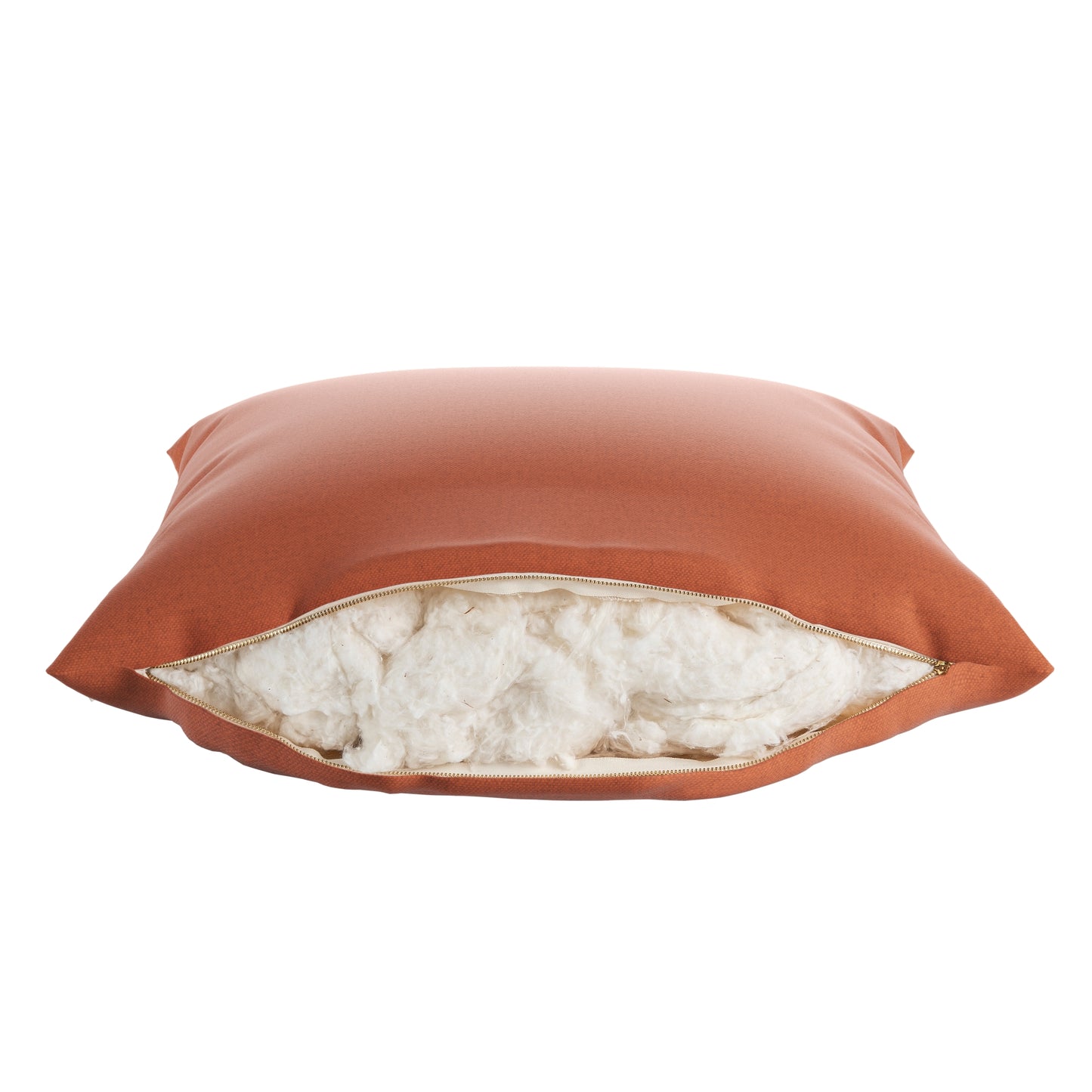 Burnt orange square pillow on a white background. Zipper open showing cotton inside.