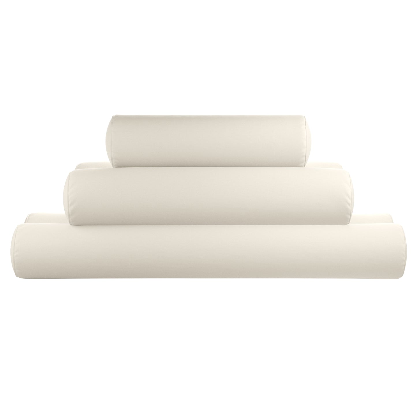 Natural white bolster pillows stacked on a white background.