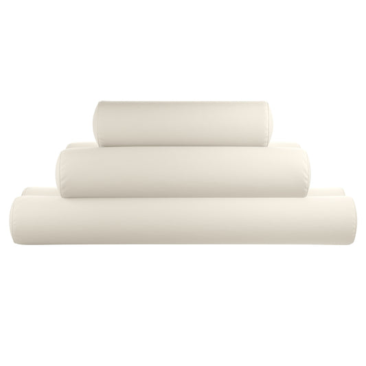 Natural white bolster pillows stacked on a white background.