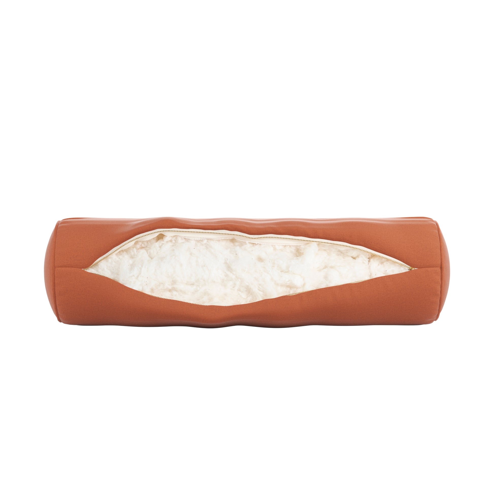 Burnt orange bolster pillow on a white background. Zipper open showing cotton inside.